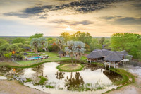 Aerial view of Onguma Bush Camp across the waterhole